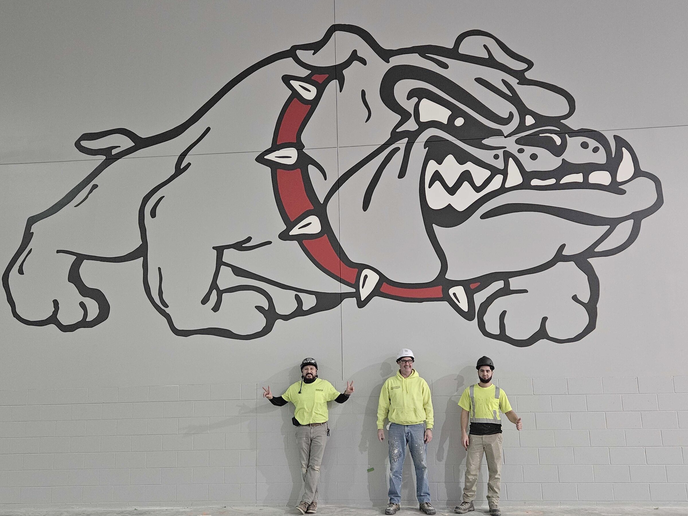 Our painters with the bulldog mural they painted at Boscobel School